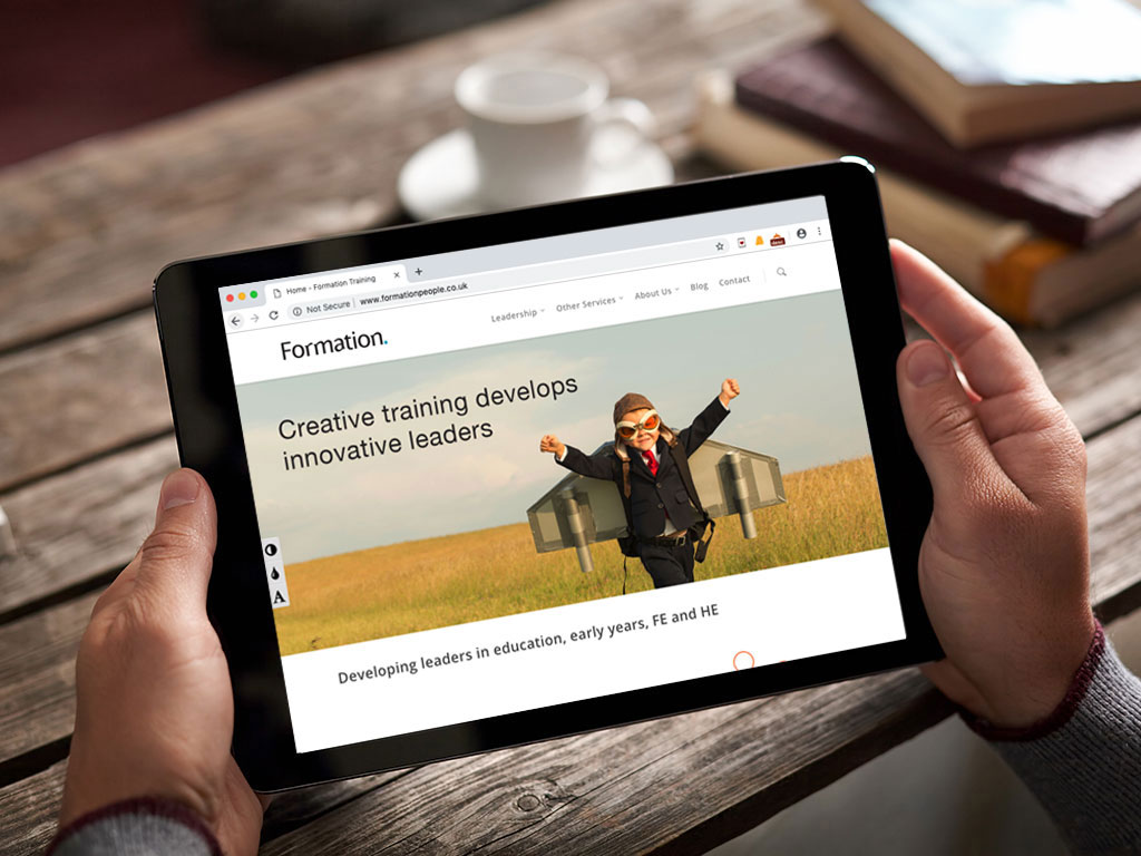 website design view on ipad aeroplane boy developing leaders in education page for Formation creative work website design and marketing