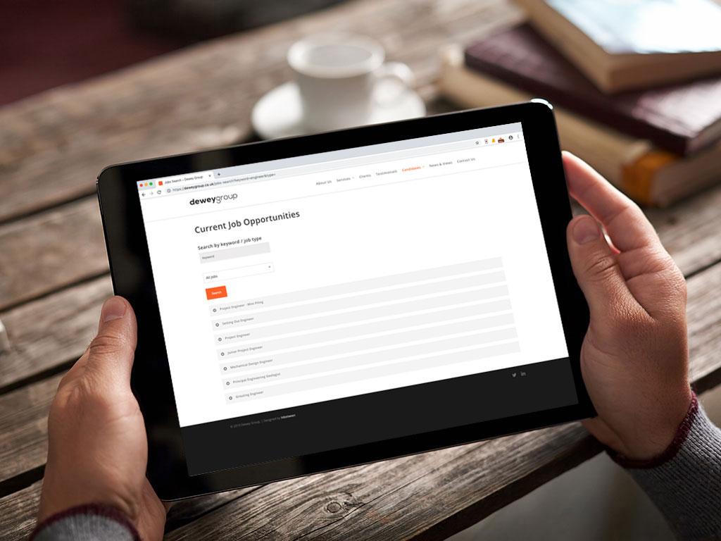 website design view on ipad jobs platform for Dewey Group creative work website design and marketing
